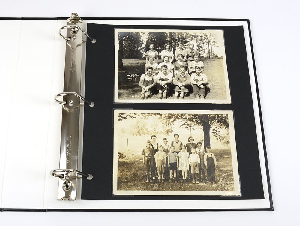 Black Acid-Free 3-hole Mounting Pages with 2 photos in the archival-quality album.